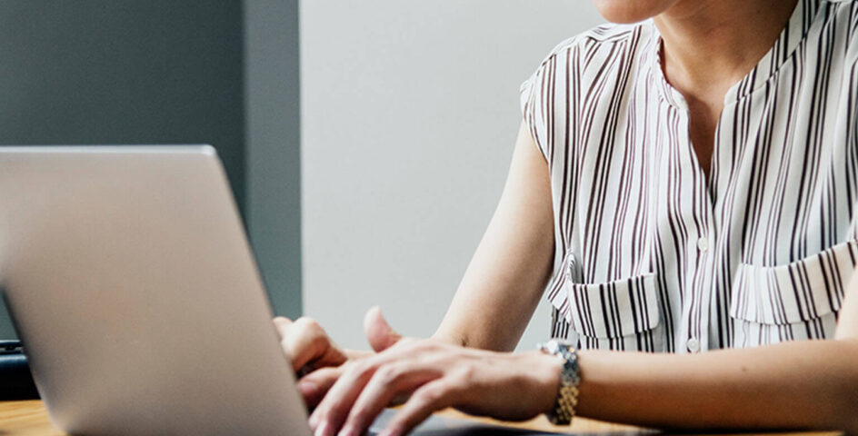 female real estate lawyer working on laptop